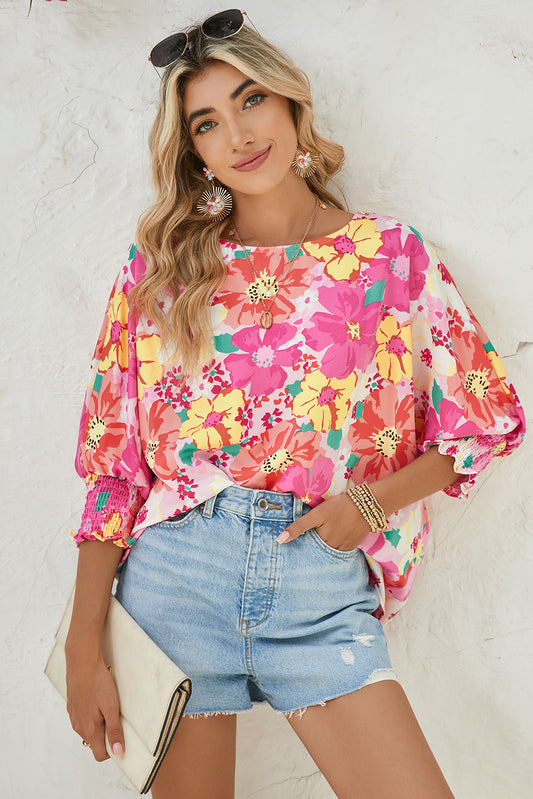 Pink Shirred Cuffs 3/4 Sleeve Boho Floral BlouseMaterial:100%Polyester



		The blouse is a stylish and feminine top featuring shirred cuffs and a boho-inspired floral print, adding a touch of bohemian charm to 