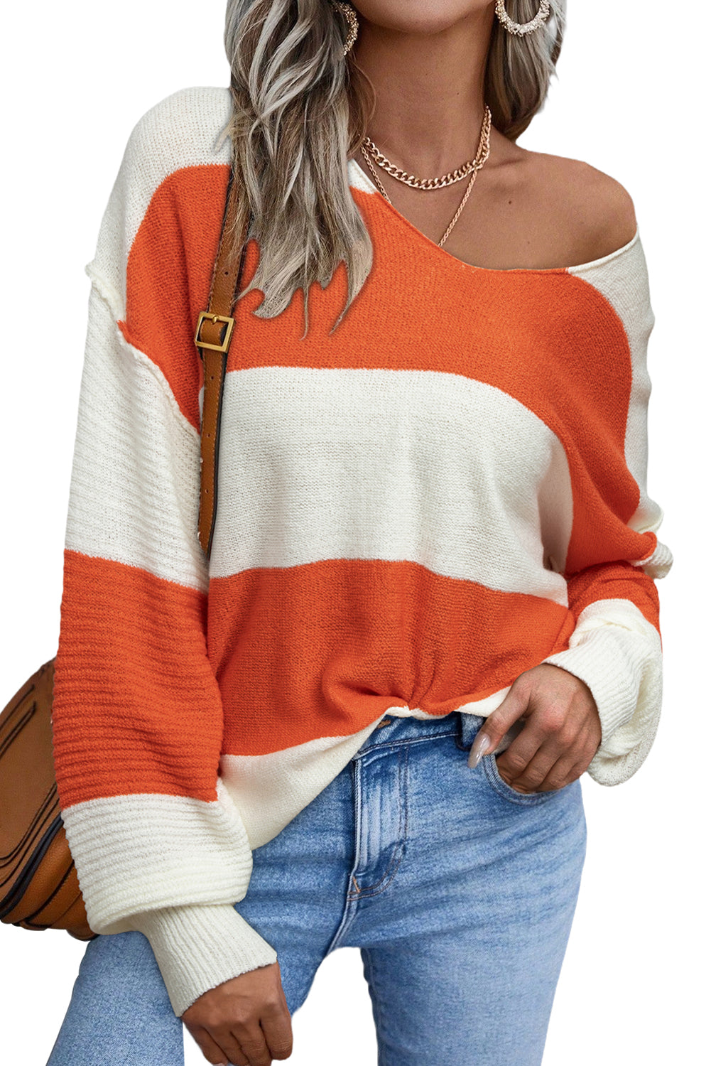 Orange Colorblock V Neck Side Slits SweaterMaterial:100%Acrylic

• Stand out in style with our sweater, blending casual stripes with a trendy rib-knit design.
• The vibrant orange hues add a pop of color to
