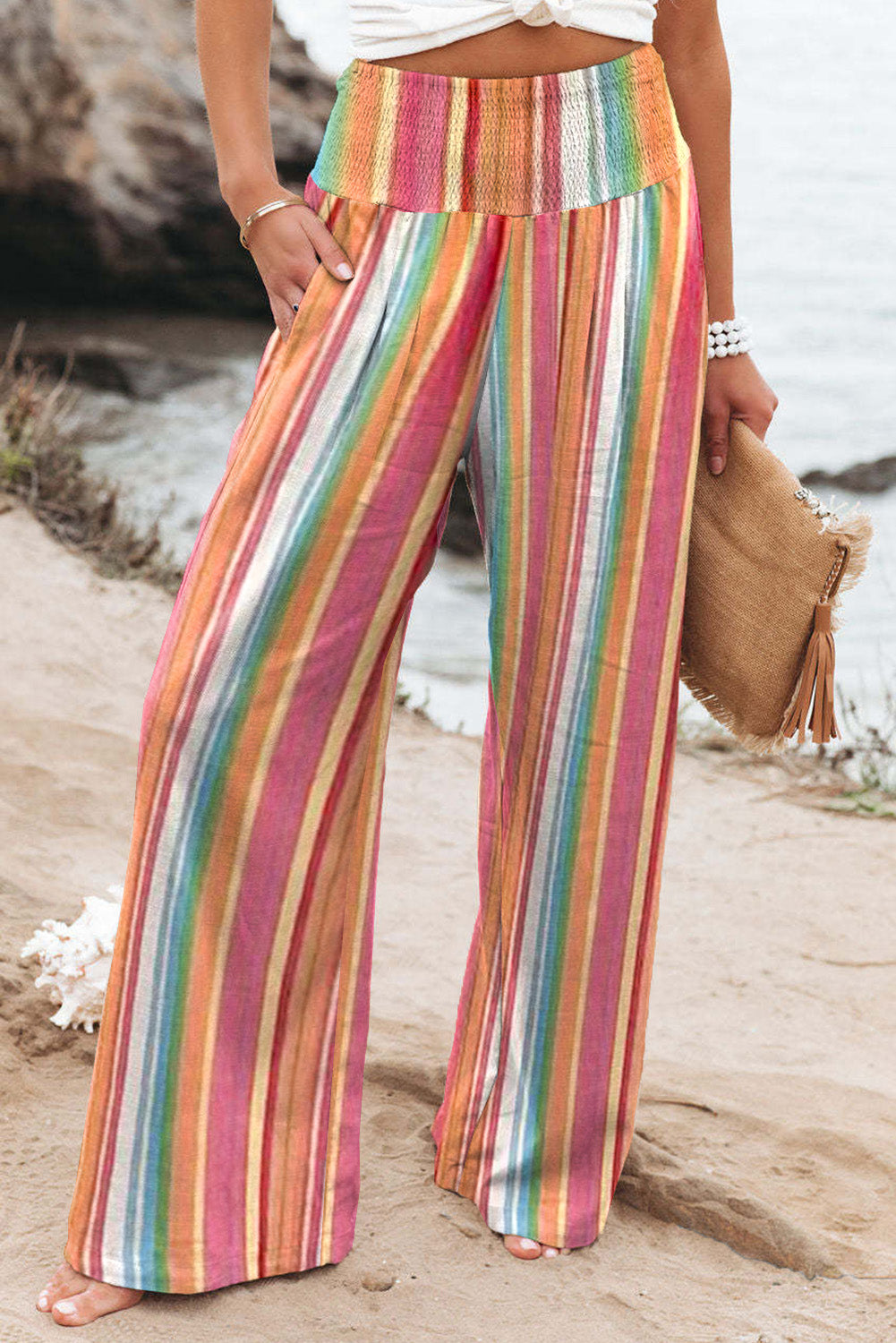 Multicolor Striped Smocked High Waisted Wide Leg Beach PantsMaterial:100%Polyester



		Made of lightweight and breathable fabric perfect for the beach or summer days.
	
	
		Features a smocked high waist design for a fla