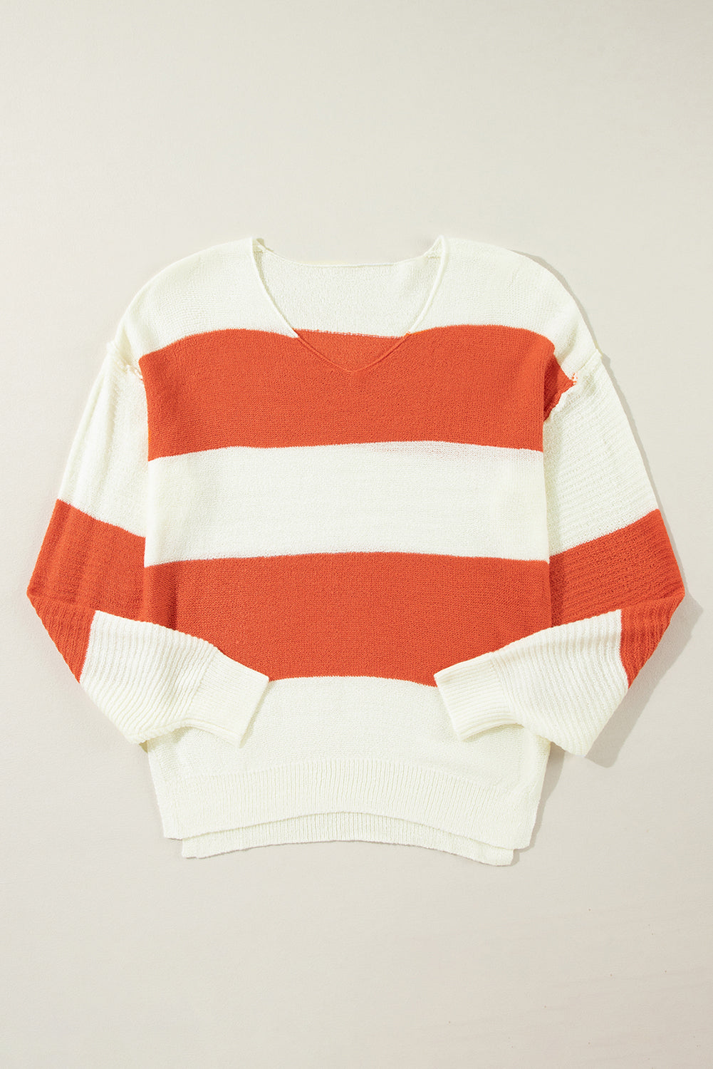 Orange Colorblock V Neck Side Slits SweaterMaterial:100%Acrylic

• Stand out in style with our sweater, blending casual stripes with a trendy rib-knit design.
• The vibrant orange hues add a pop of color to