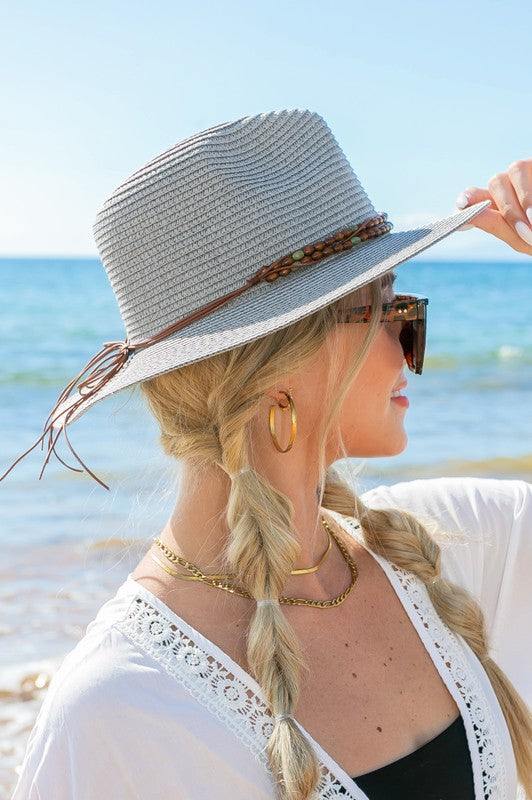 Beaded Belt Straw Panama Fedora HatBeaded Belt Straw Panama HatDetailsBeaded or Embroidered Belt AccentSuede TieMaterial: 100% strawBrim length: 3.25"
Style: Fedora hat
Embellishment: Bead or Embroide
