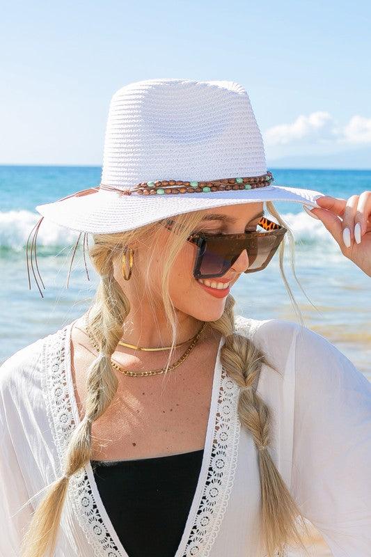 Beaded Belt Straw Panama Fedora HatBeaded Belt Straw Panama HatDetailsBeaded or Embroidered Belt AccentSuede TieMaterial: 100% strawBrim length: 3.25"
Style: Fedora hat
Embellishment: Bead or Embroide