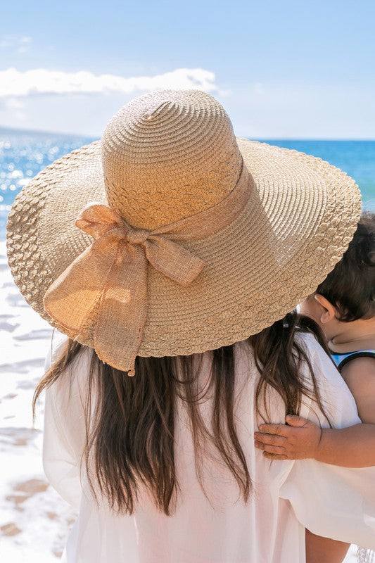 Scallop Edge Bow Accent SunhatScallop Edge Bow Accent Sunhat DetailsScallop edge designBurlap bow accentHat material: 100% strawBrim length: 5.5"Foldable &amp; packableInside lining for all-day c