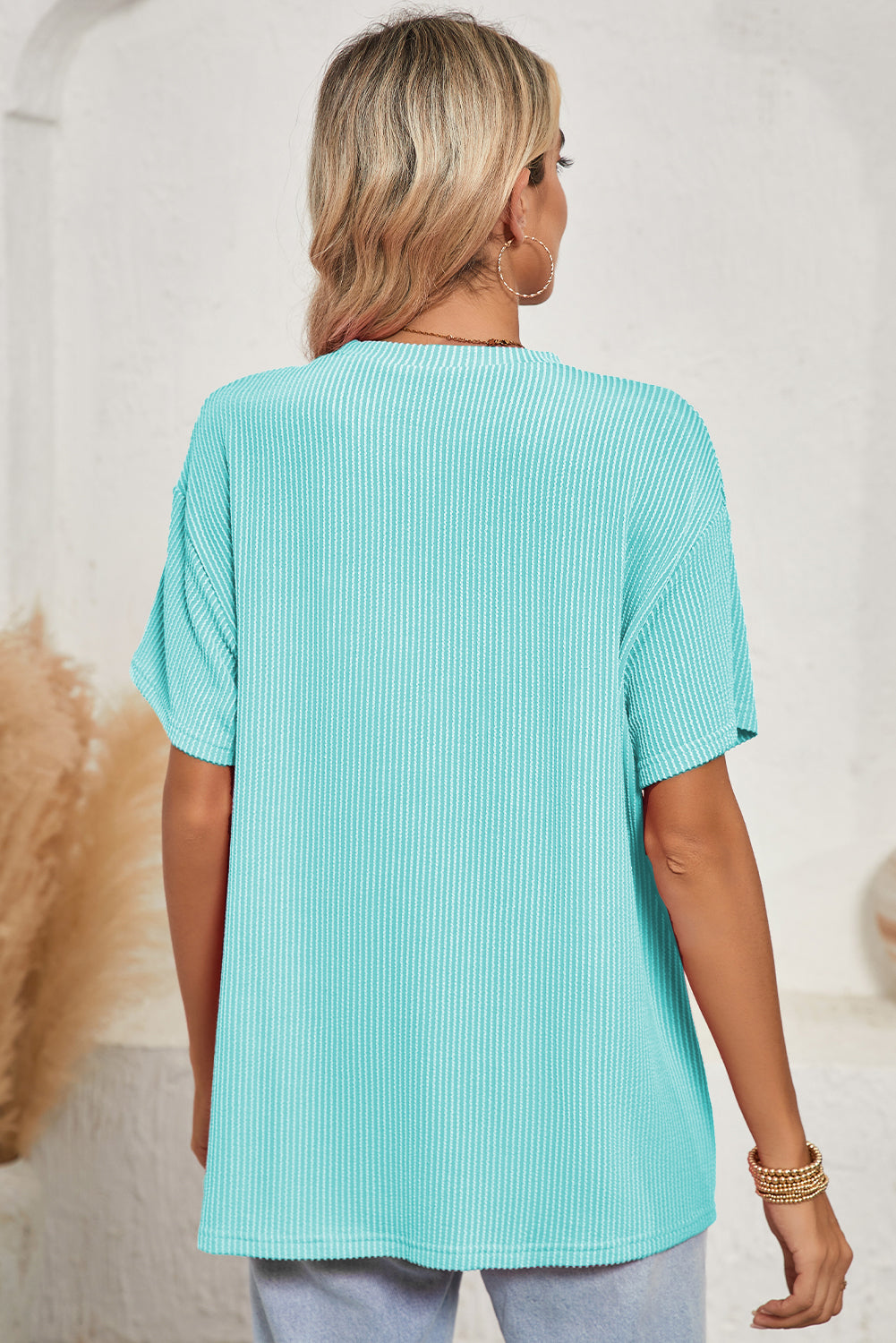 Pink Crinkle Rib Knit Pocketed Loose Fit Crew Neck T ShirtMaterial:75%Polyester+20%Viscose+5%Elastane

• Pink T Shirt offers a charming, feminine touch with its soft pink color and crinkle rib texture, perfect for a casual