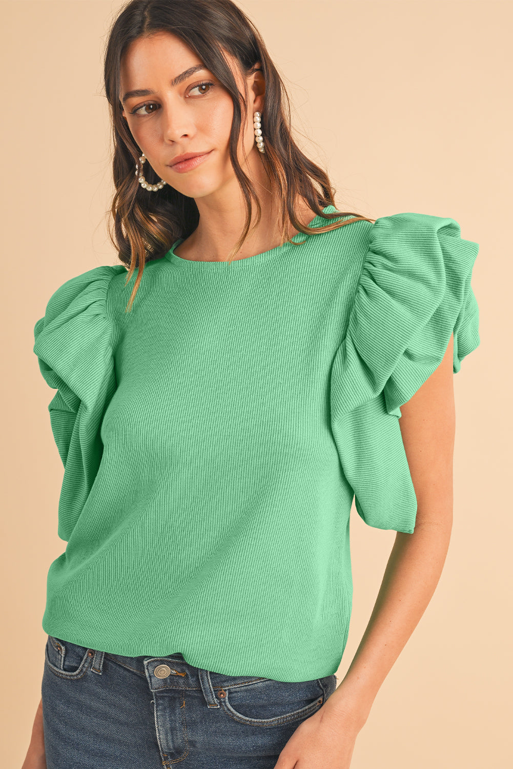 Green Solid Color Ruffle Sleeve Ribbed BlouseMaterial:65%cotton+33%polyester+2%Elastane



		The blouse features ruffle sleeves, which add a playful and romantic touch to the overall design. 
	
	
		The sol