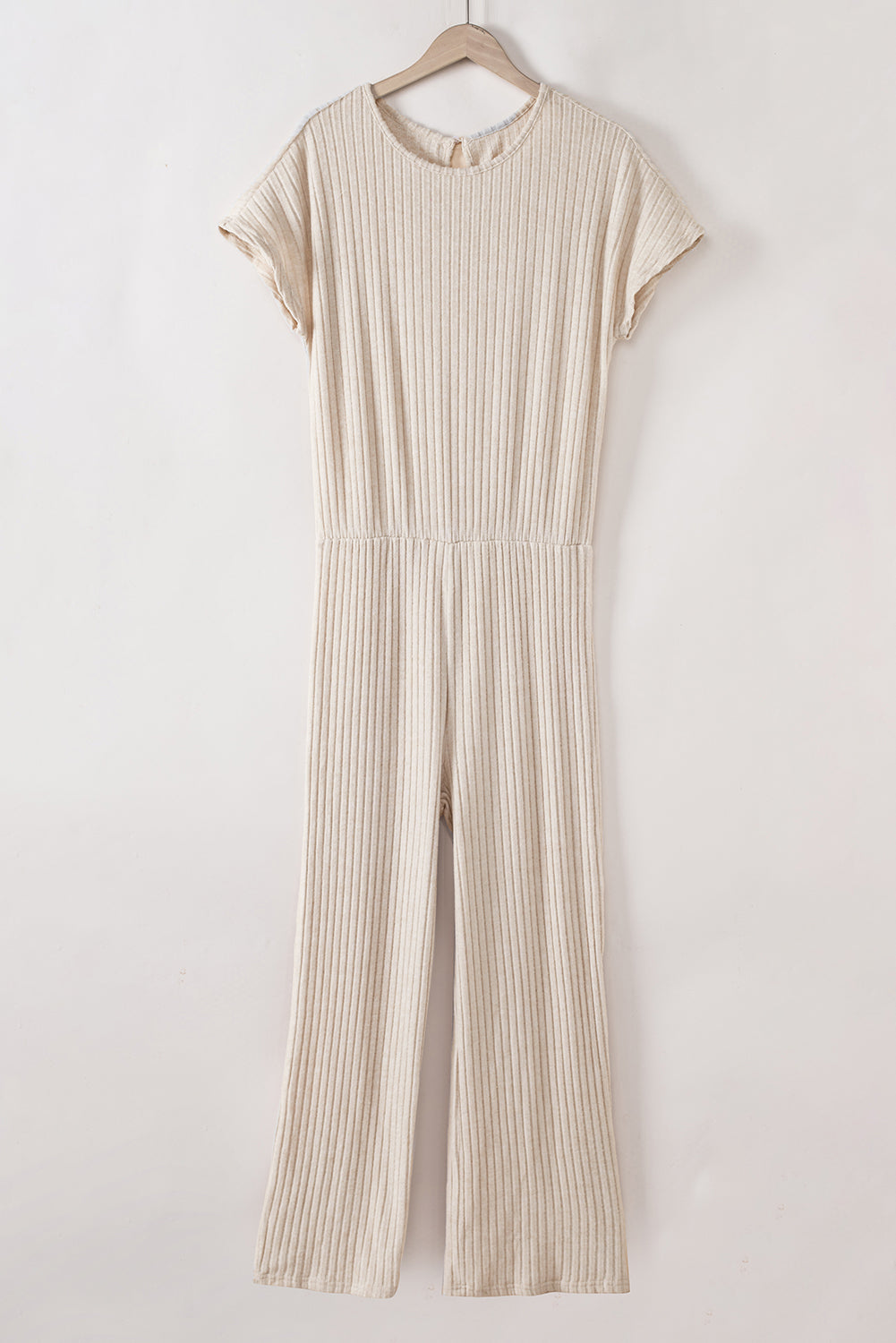 Grass Green Solid Color Ribbed Short Sleeve Wide Leg JumpsuitMaterial:85%Polyester+10%Viscose+5%Elastane



		The jumpsuit is a versatile and trendy one-piece outfit, featuring a solid color design that offers a sleek and mi