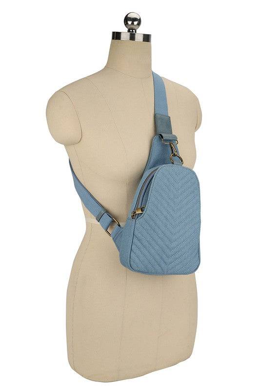 Chevron Quilted Denim Sling BagChevron Quilted Denim Sling Bag Denim canvas Faux vegan leather Zip top closure Antique Gold-tone hardware Adjustable shoulder strap L 7.5 * H 12.5 * W 3