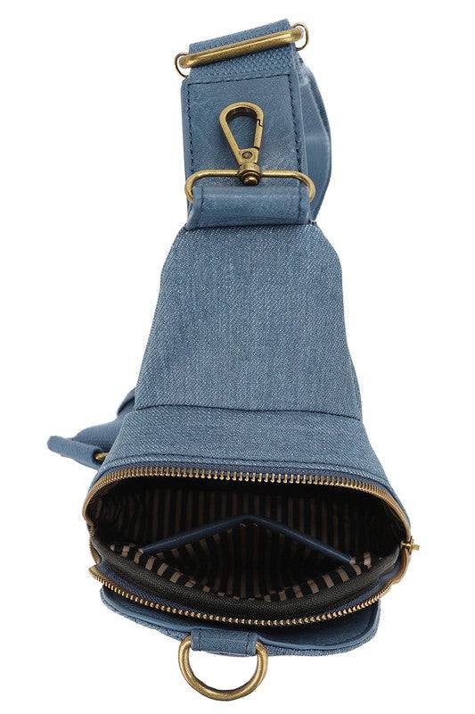 Chevron Quilted Denim Sling BagChevron Quilted Denim Sling Bag Denim canvas Faux vegan leather Zip top closure Antique Gold-tone hardware Adjustable shoulder strap L 7.5 * H 12.5 * W 3