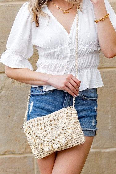 Sofia Foldover Straw Crossbody BagSofia Foldover Straw CrossbodyFold Over FlapHand Tied Rattan Edge DetailMeasurement: 6.5"x10"Woven Straw ExteriorLined Interior: 30% Cotton/70% PolyesterAttached Wov