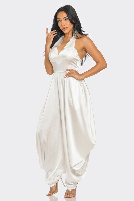 Ivory Serenity JumpsuitStep into the spotlight with our Ivory Serenity Jumpsuit, designed for the woman who embodies grace and style. This exquisite piece combines the sophistication of a 