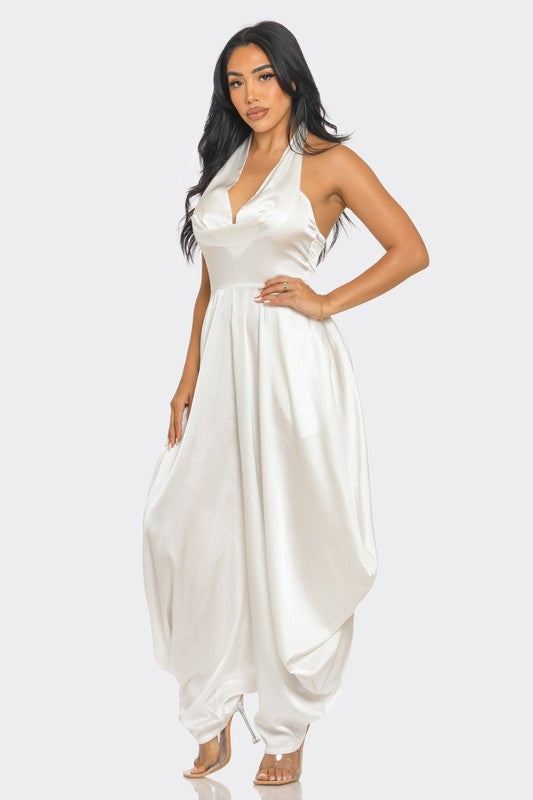 Ivory Serenity JumpsuitStep into the spotlight with our Ivory Serenity Jumpsuit, designed for the woman who embodies grace and style. This exquisite piece combines the sophistication of a 