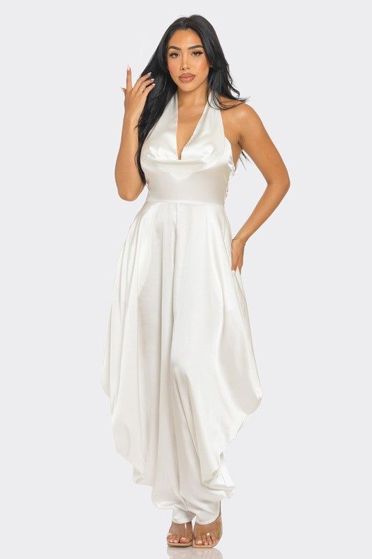 Ivory Serenity JumpsuitStep into the spotlight with our Ivory Serenity Jumpsuit, designed for the woman who embodies grace and style. This exquisite piece combines the sophistication of a 