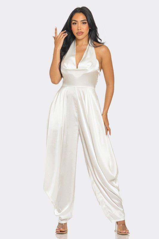 Ivory Serenity JumpsuitStep into the spotlight with our Ivory Serenity Jumpsuit, designed for the woman who embodies grace and style. This exquisite piece combines the sophistication of a 