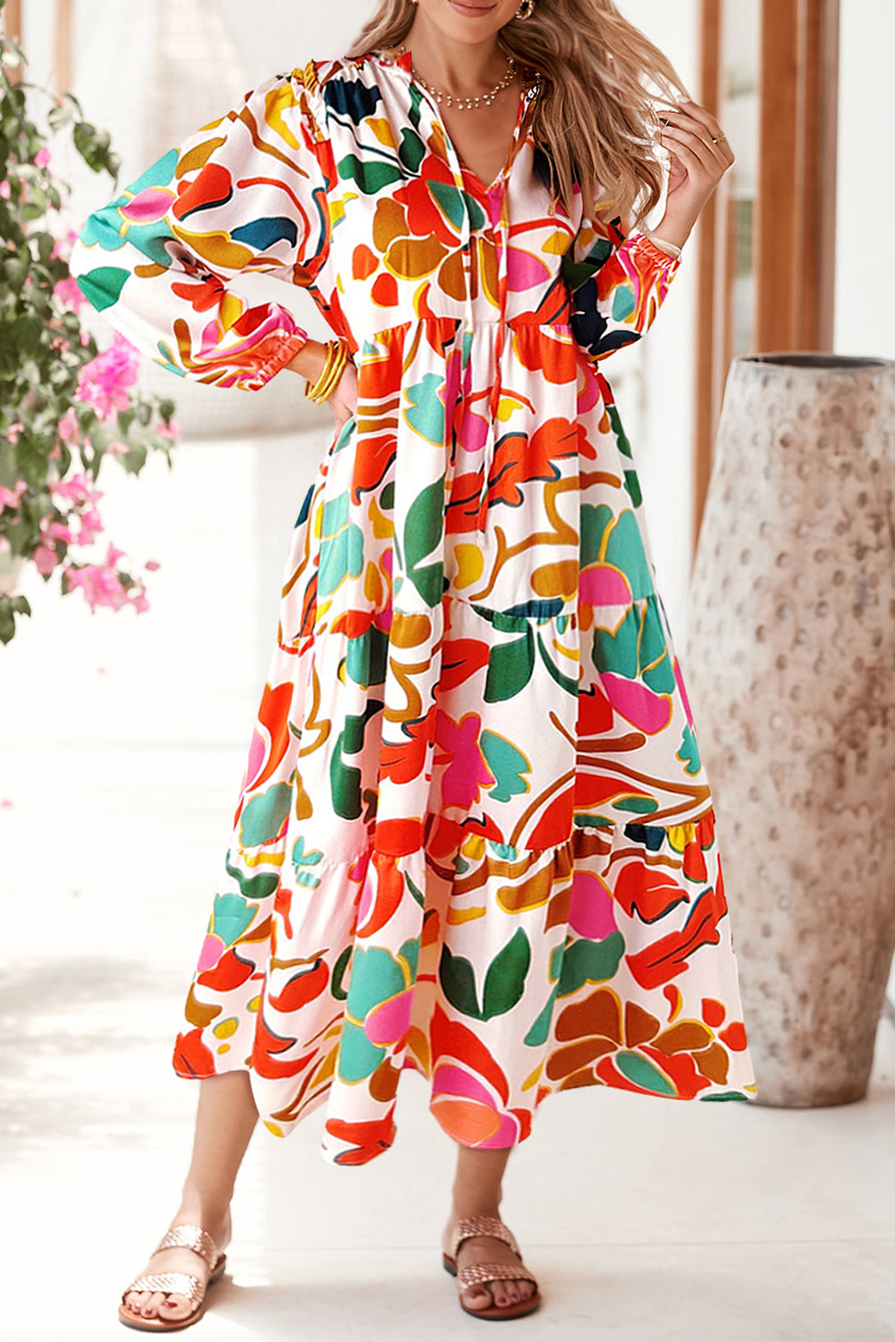 Orange Abstract Tie V Neck Tiered Maxi DressMaterial:100%Polyester

• Stand out in this maxi dress, perfect for boho-chic lovers seeking a vibrant statement piece.
• The abstract print adds a touch of artist