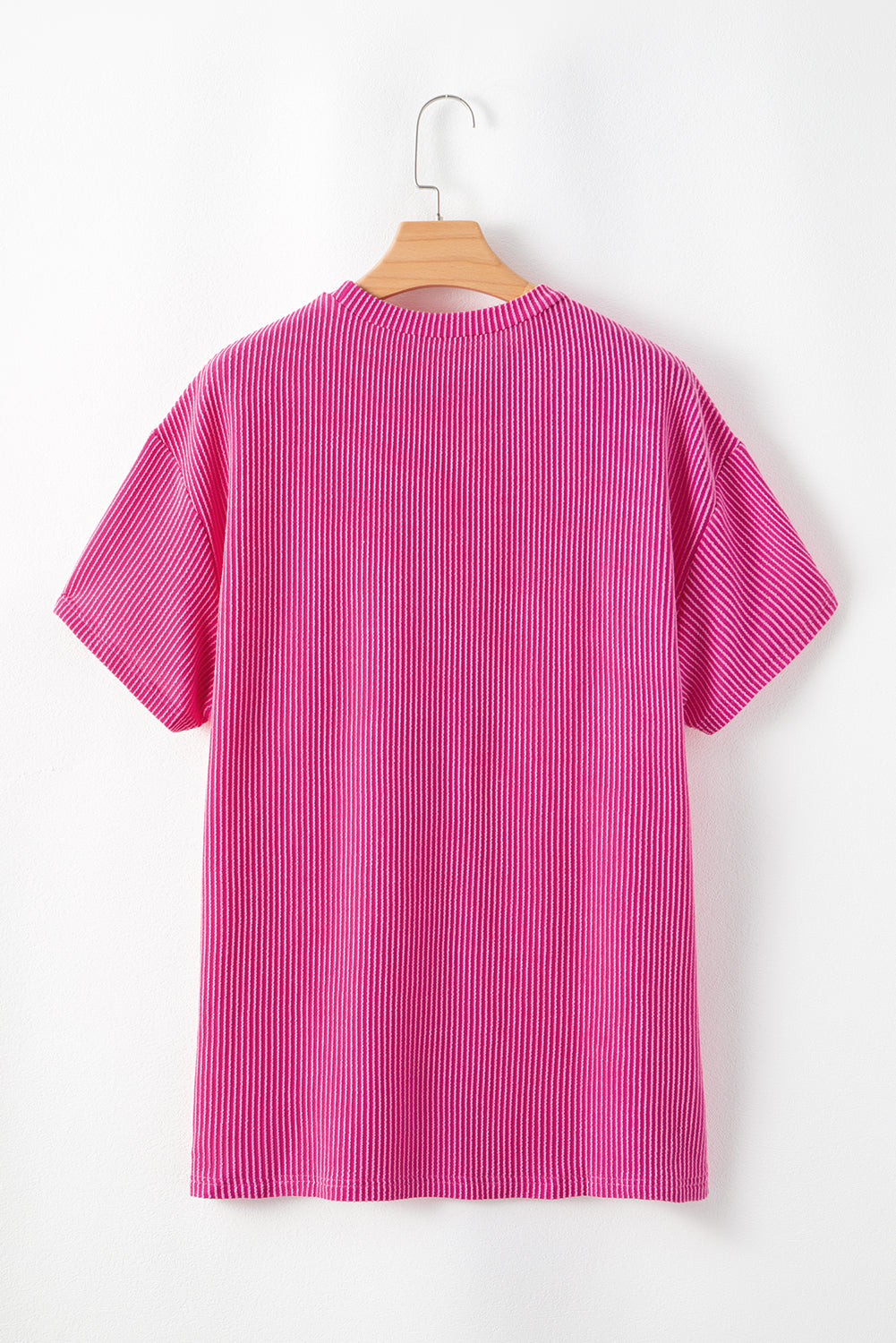 Pink Crinkle Rib Knit Pocketed Loose Fit Crew Neck T ShirtMaterial:75%Polyester+20%Viscose+5%Elastane

• Pink T Shirt offers a charming, feminine touch with its soft pink color and crinkle rib texture, perfect for a casual