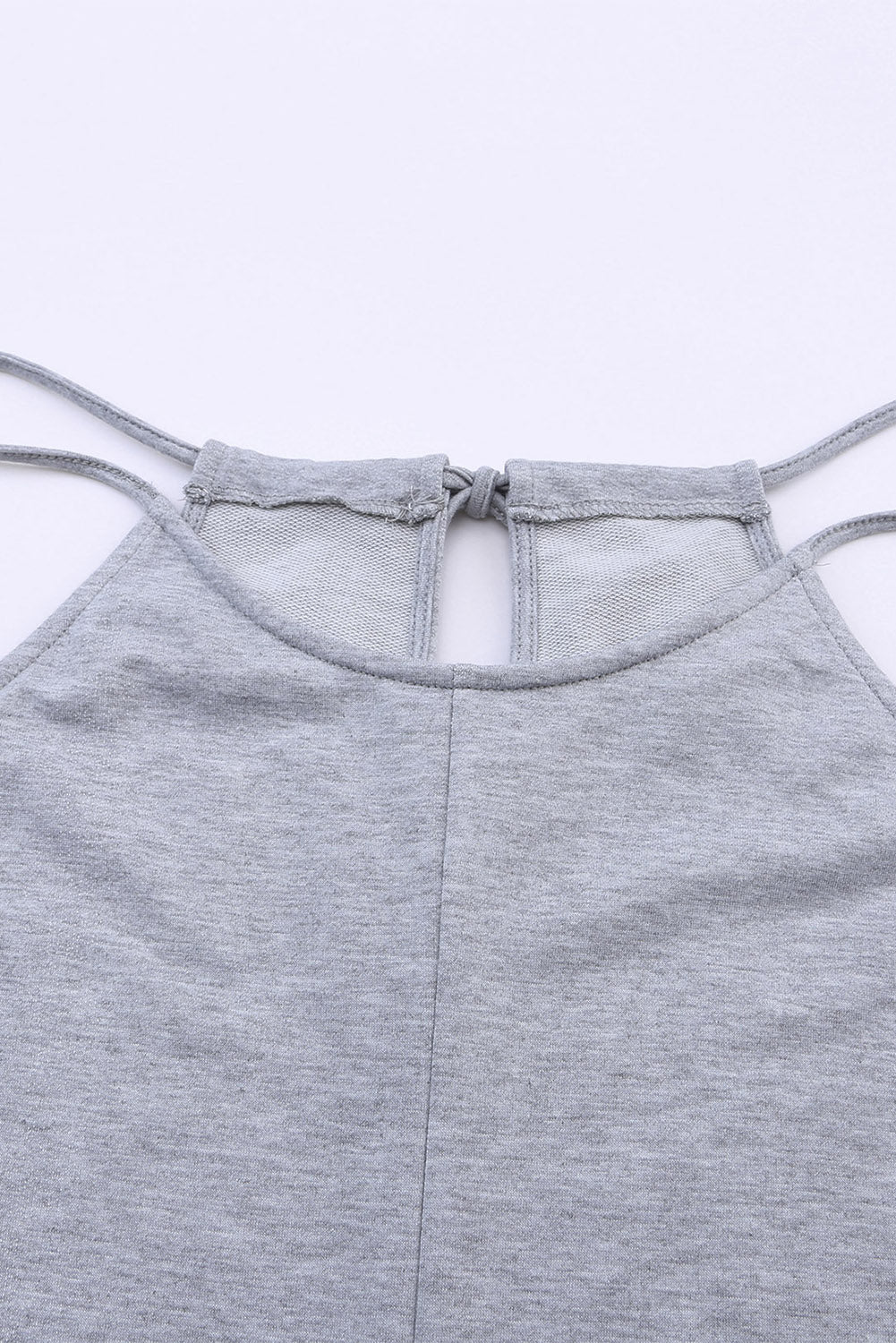 Gray Loose Fit Side Pockets Spaghetti Strap Wide Leg JumpsuitMaterial:65%Polyester+30%Cotton+5%Elastane



		Featuring a loose fit, the wide leg
jumpsuit provides freedom of movement
	
	
		Spaghetti straps highlight wome