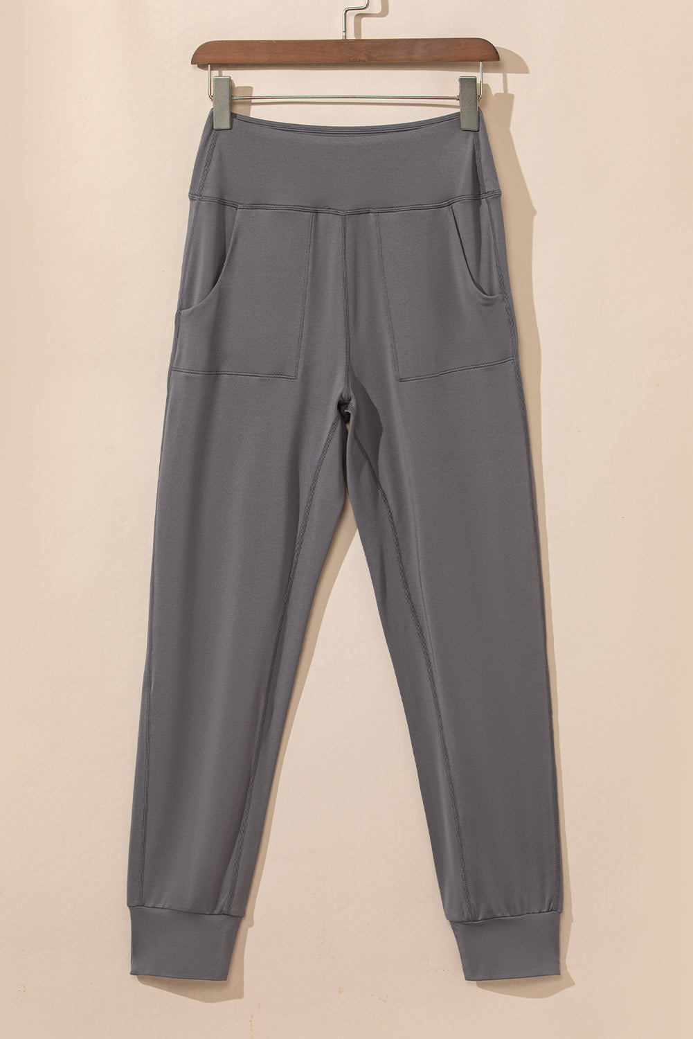 Black Exposed Seam High Waist Pocketed JoggersMaterial:100%Polyester



		These solid joggers are a versatile addition to your wardrobe, suitable for individuals of all body types.

	
		The exposed seam desi