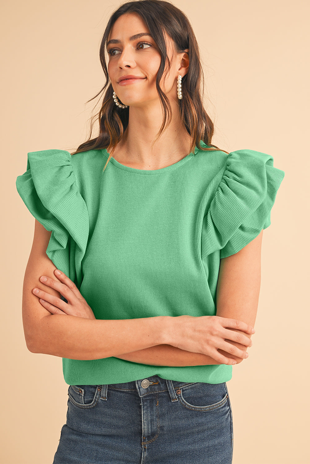 Green Solid Color Ruffle Sleeve Ribbed BlouseMaterial:65%cotton+33%polyester+2%Elastane



		The blouse features ruffle sleeves, which add a playful and romantic touch to the overall design. 
	
	
		The sol