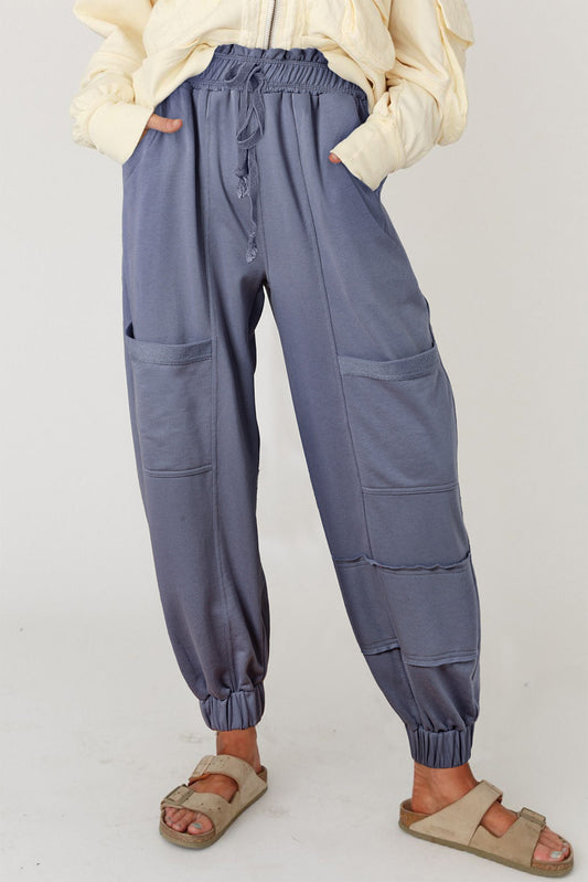 Wild Wind Multi Pockets Lace-up Waist Harem PantsMaterial:65%Polyester+35%Cotton

• Crafted with a blend of comfort and style, these pants feature a lace-up waist design that allows for a customizable fit, perfect