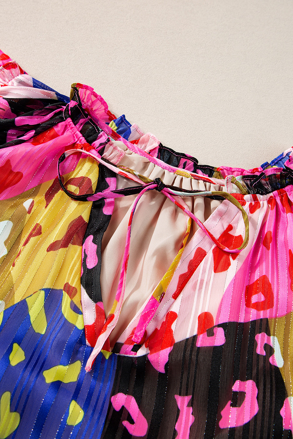 Multicolour Leopard Flutter Sleeve V Neck Crinkled BlouseMaterial:100%Polyester

• Stand out in style with this blouse, perfect for adding a touch of wild elegance to your wardrobe.
• The vibrant multicolored leopard pri