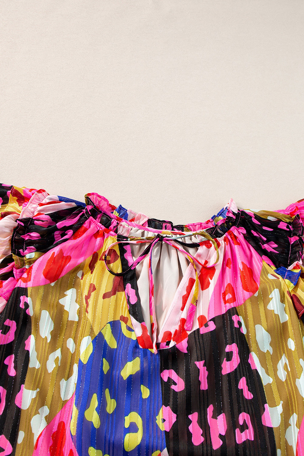 Multicolour Leopard Flutter Sleeve V Neck Crinkled BlouseMaterial:100%Polyester

• Stand out in style with this blouse, perfect for adding a touch of wild elegance to your wardrobe.
• The vibrant multicolored leopard pri