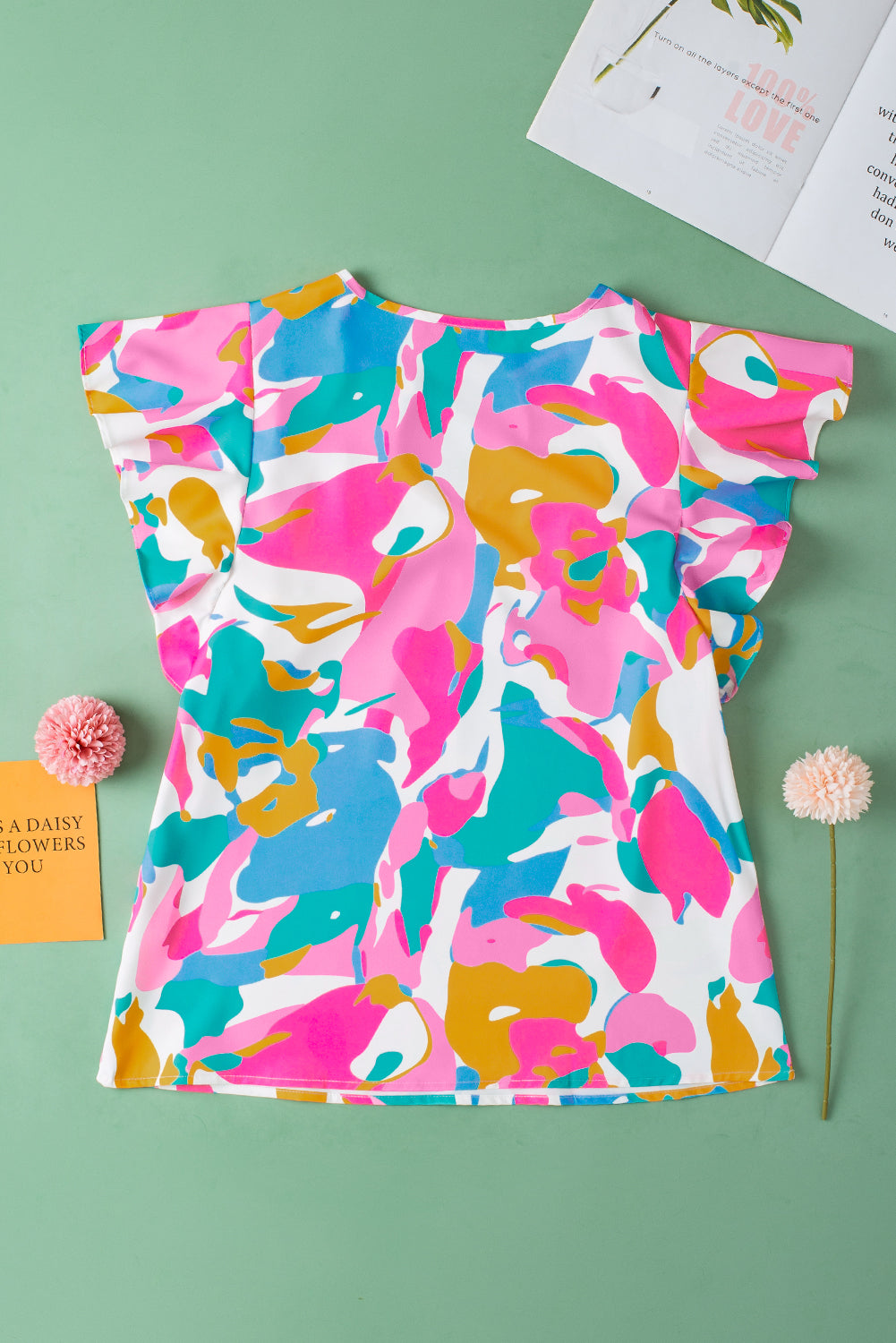 Green Abstract Print Smocked Notched Neck Ruffle Sleeve BlouseMaterial:100%Polyester

• Embrace a bohemian spirit with the blouse, featuring a vibrant green hue that adds a pop of color to any outfit.
• The abstract print des