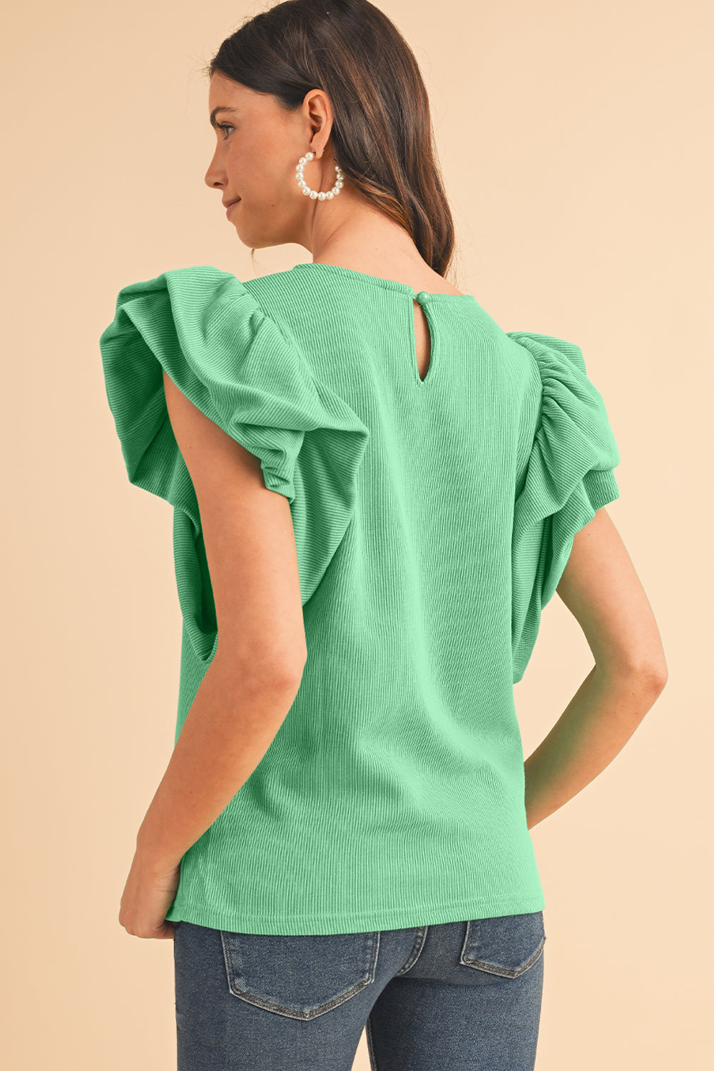 Green Solid Color Ruffle Sleeve Ribbed BlouseMaterial:65%cotton+33%polyester+2%Elastane



		The blouse features ruffle sleeves, which add a playful and romantic touch to the overall design. 
	
	
		The sol
