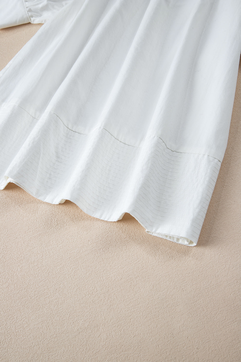 White Solid Color Ruched Bubble Sleeve V Neck ShirtMaterial:100%Cotton

• The ruched detailing on the sleeves adds a touch of texture and visual interest, making this top a standout choice for any occasion. 
• Craf