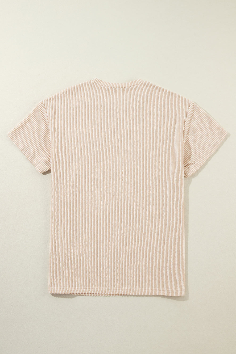 Pink Crinkle Rib Knit Pocketed Loose Fit Crew Neck T ShirtMaterial:75%Polyester+20%Viscose+5%Elastane

• Pink T Shirt offers a charming, feminine touch with its soft pink color and crinkle rib texture, perfect for a casual
