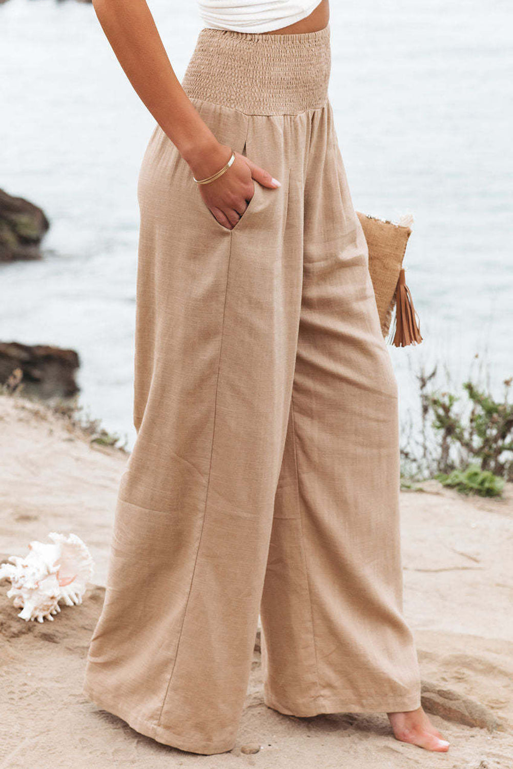 Black Smocked Wide Waistband High Waist Wide Leg PantsMaterial:65%COTTON+35%POLYESTER



		Flattering smocked waistband cinches at the
waist for a lovely silhouette
	
	
		High waist design elongates legs for a
st