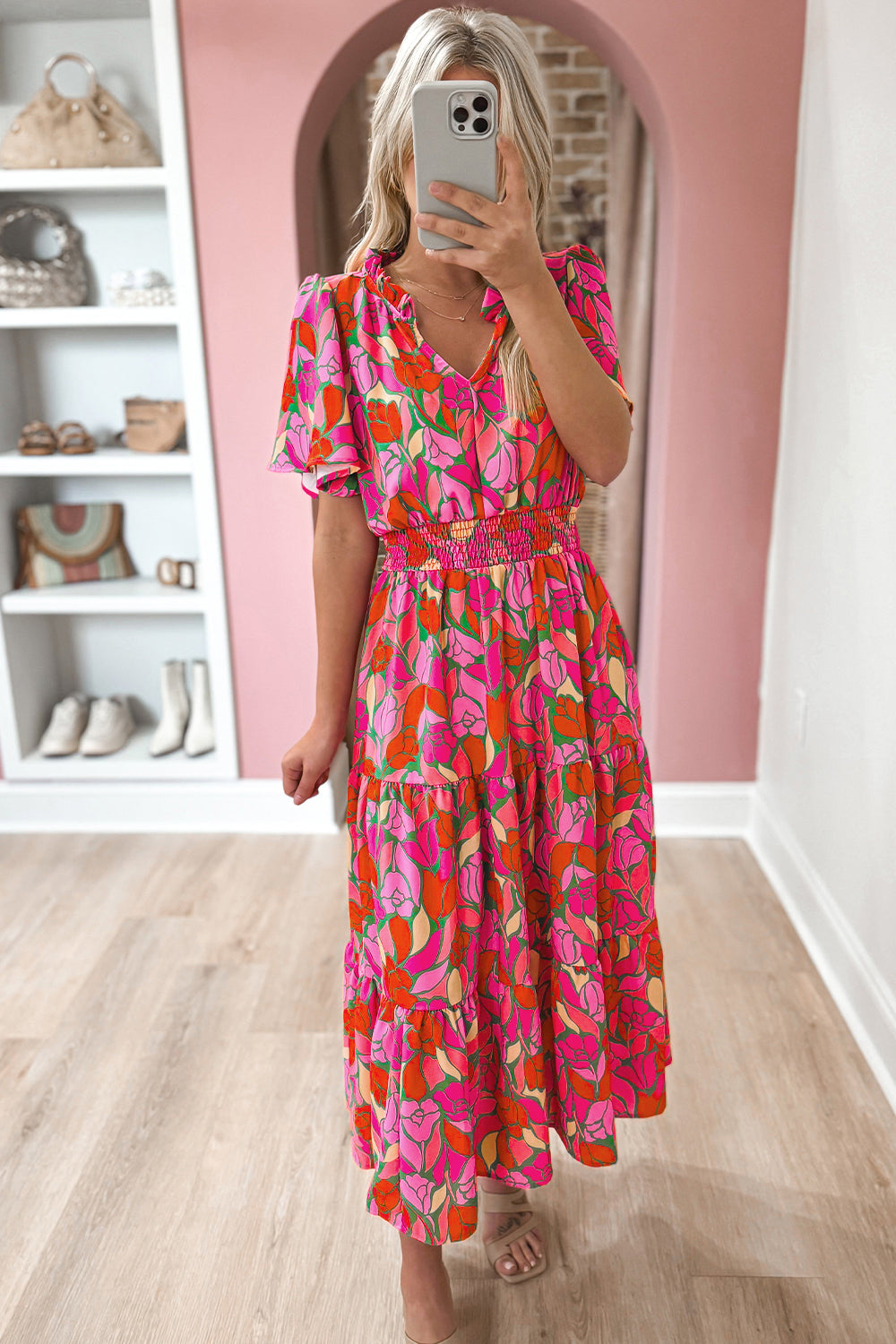 Rose Floral Flounce Sleeve Smocked Waist Tiered Maxi DressMaterial:100%Polyester

• Exude bohemian elegance in this maxi dress, featuring a smocked waist for a flattering silhouette.
• The tiered design adds a whimsical t