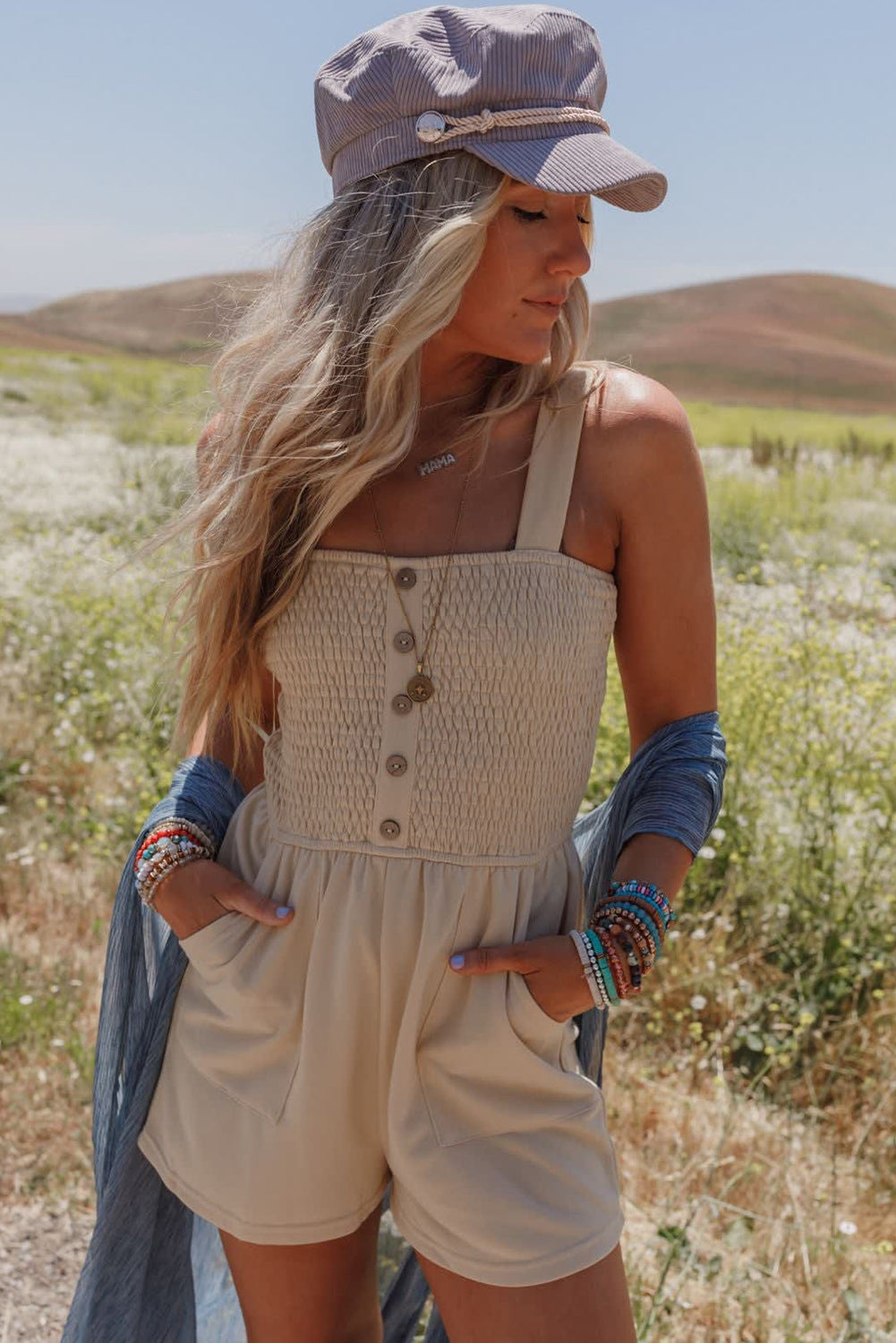 Beige Solid Color Buttons Smocked Sleeveless RomperMaterial:85%Polyester+10%Cotton+5%Elastane

• Its high waist design adds a flattering touch to any silhouette.
• Embrace the versatility of this romper with its sl