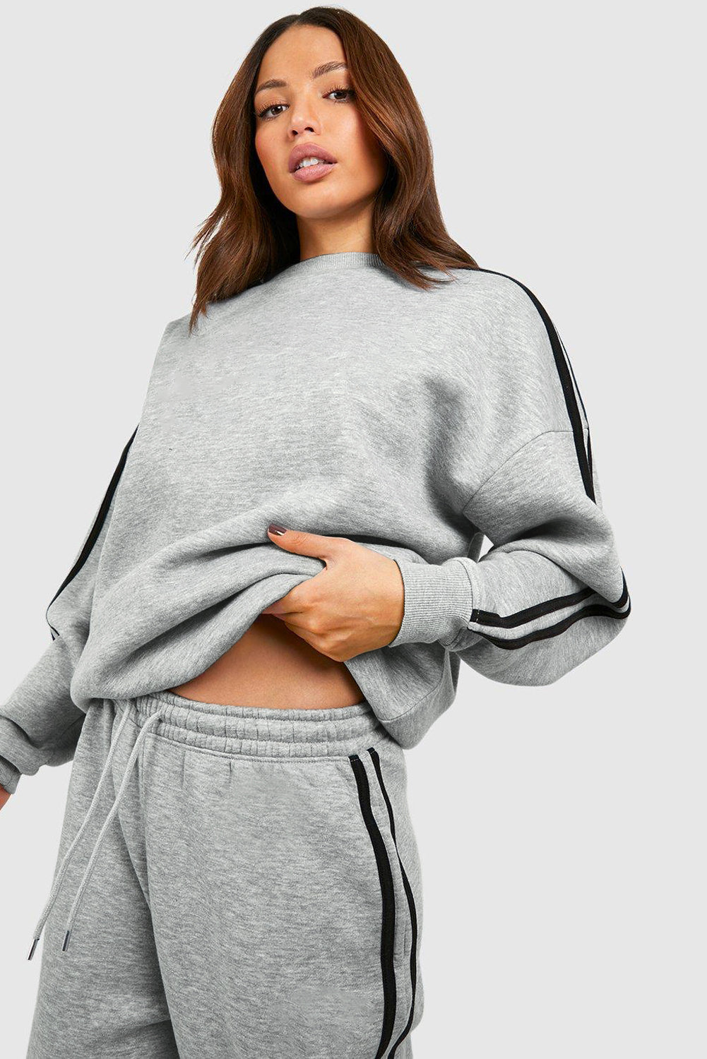 Light Grey Solid Color Side Striped Sweatshirt Pants SetMaterial:50%Polyester+50%Cotton

• This pants set exudes a modern appeal perfect for casual outings or lounging at home.
• Crafted from high-quality fabric for a s