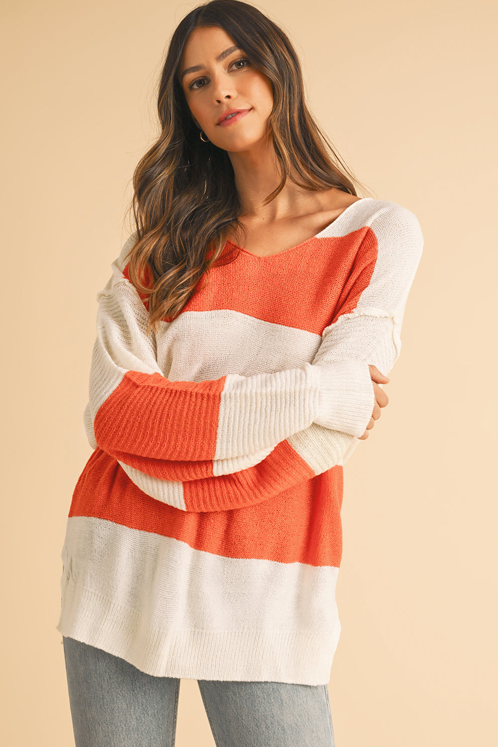 Orange Colorblock V Neck Side Slits SweaterMaterial:100%Acrylic

• Stand out in style with our sweater, blending casual stripes with a trendy rib-knit design.
• The vibrant orange hues add a pop of color to