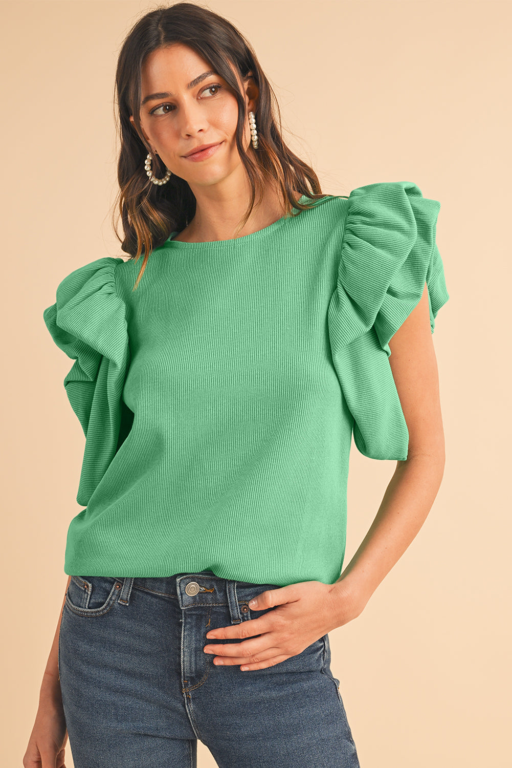 Green Solid Color Ruffle Sleeve Ribbed BlouseMaterial:65%cotton+33%polyester+2%Elastane



		The blouse features ruffle sleeves, which add a playful and romantic touch to the overall design. 
	
	
		The sol