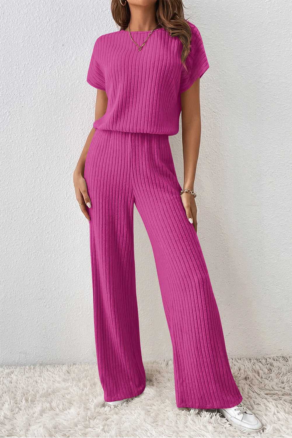 Grass Green Solid Color Ribbed Short Sleeve Wide Leg JumpsuitMaterial:85%Polyester+10%Viscose+5%Elastane



		The jumpsuit is a versatile and trendy one-piece outfit, featuring a solid color design that offers a sleek and mi