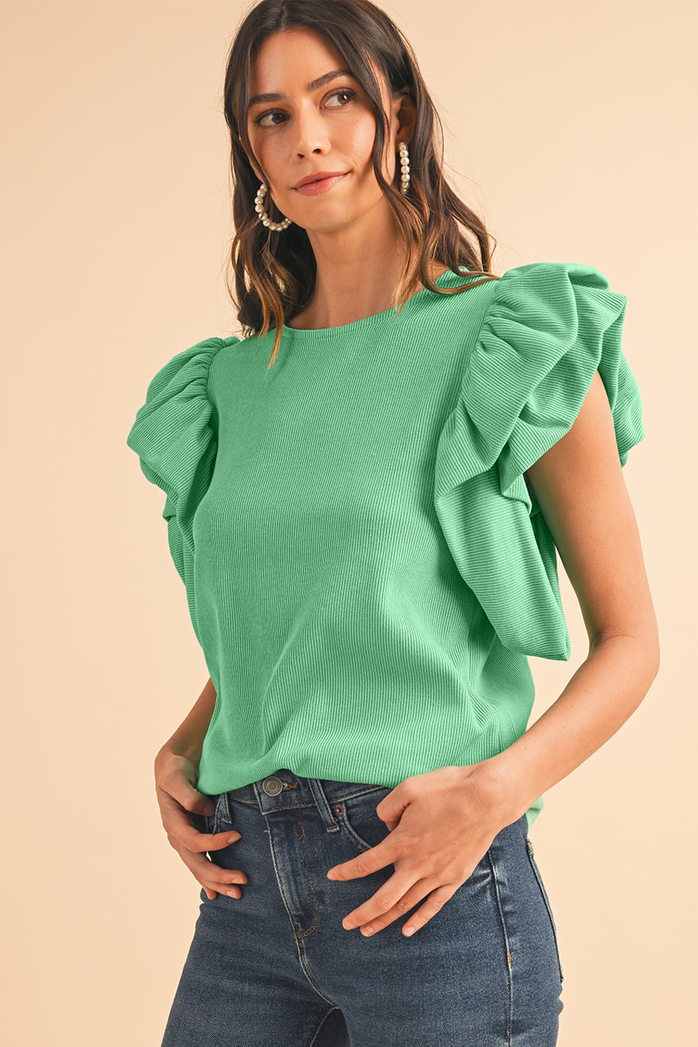 Green Solid Color Ruffle Sleeve Ribbed BlouseMaterial:65%cotton+33%polyester+2%Elastane



		The blouse features ruffle sleeves, which add a playful and romantic touch to the overall design. 
	
	
		The sol