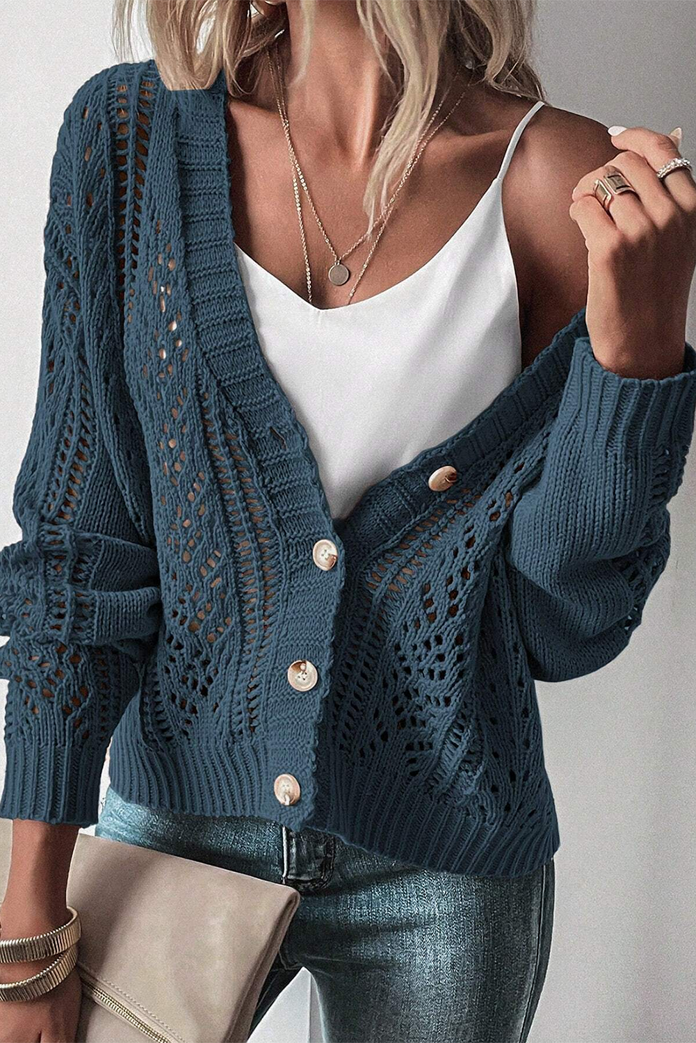 Real Teal Hollow Knit Drop Shoulder CardiganMaterial:60%Cotton+40%Acrylic

• Elevate your casual wardrobe with the cardigan, crafted for comfort and style, ideal for layering during transitional seasons.
• T