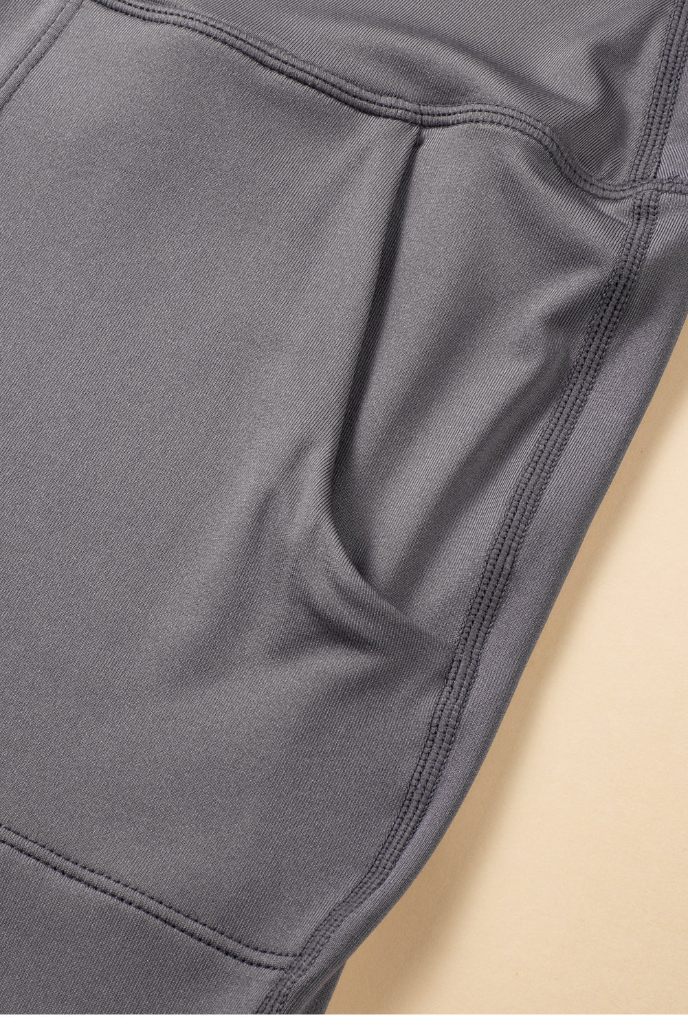 Black Exposed Seam High Waist Pocketed JoggersMaterial:100%Polyester



		These solid joggers are a versatile addition to your wardrobe, suitable for individuals of all body types.

	
		The exposed seam desi