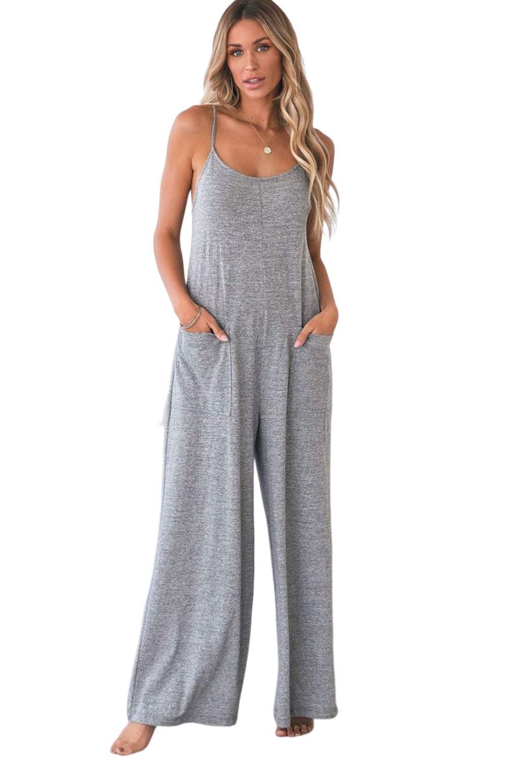 Gray Loose Fit Side Pockets Spaghetti Strap Wide Leg JumpsuitMaterial:65%Polyester+30%Cotton+5%Elastane



		Featuring a loose fit, the wide leg
jumpsuit provides freedom of movement
	
	
		Spaghetti straps highlight wome