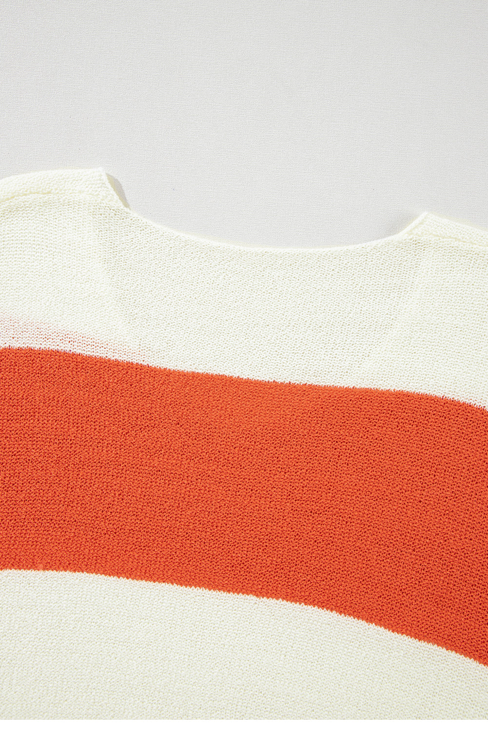 Orange Colorblock V Neck Side Slits SweaterMaterial:100%Acrylic

• Stand out in style with our sweater, blending casual stripes with a trendy rib-knit design.
• The vibrant orange hues add a pop of color to