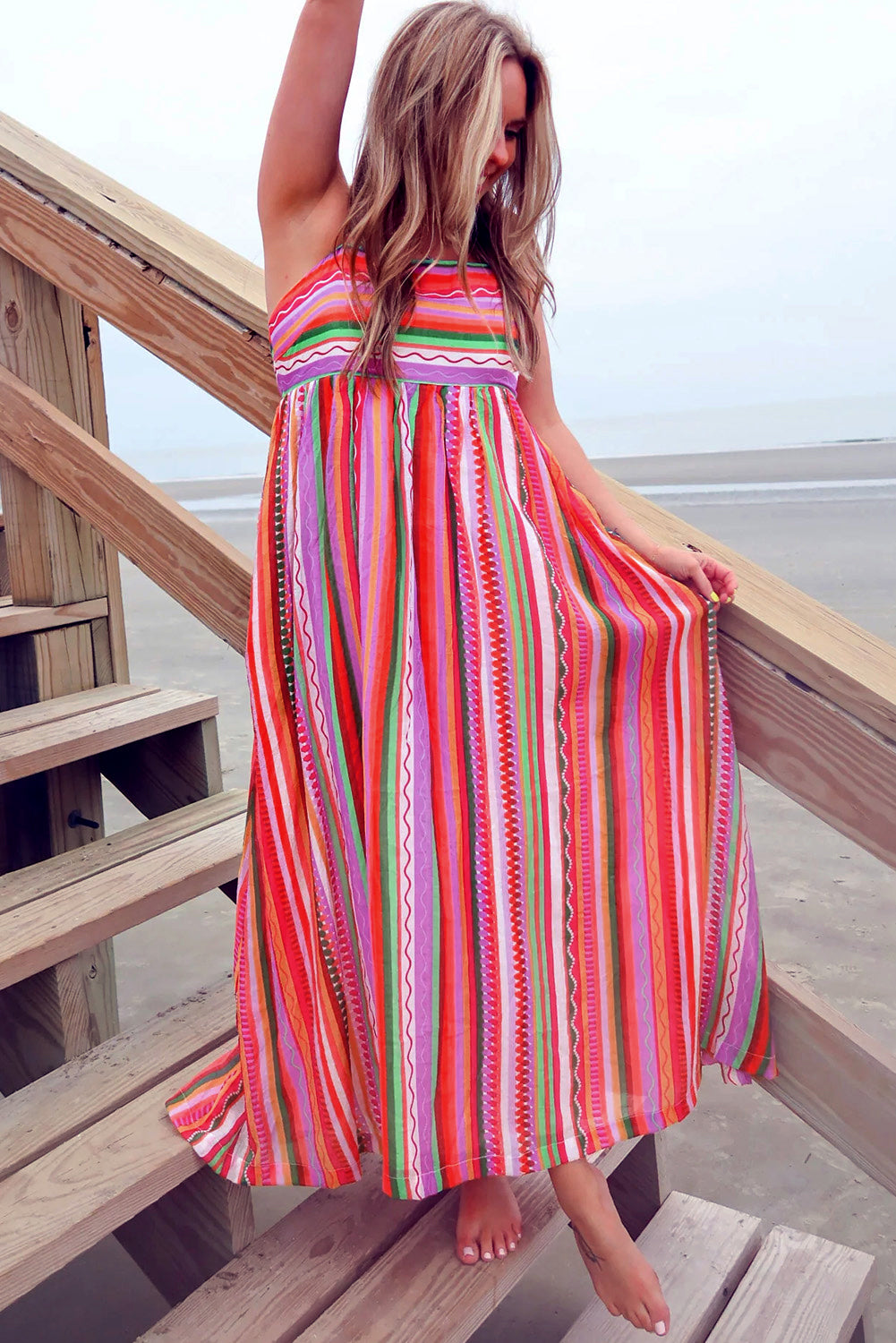 Multicolour Boho Striped Spaghetti Strap Smocked Back Maxi DressMaterial:100%Polyester

• Embrace a vibrant blend of colors in this maxi dress, perfect for daily wear with its relaxed, sleeveless design.
• The shirred back ensu