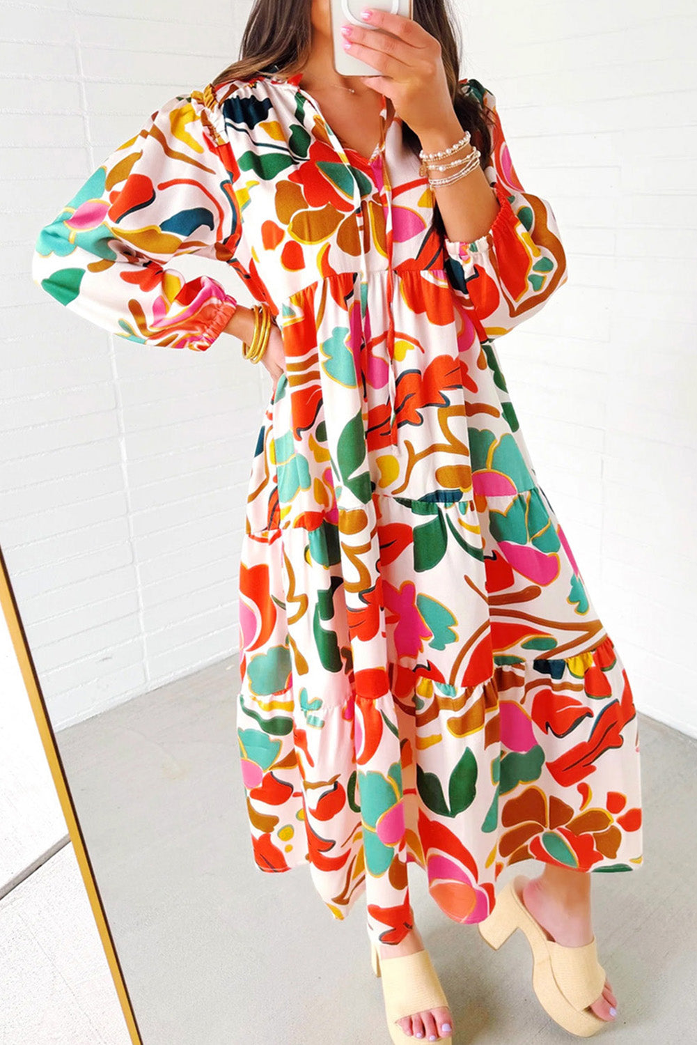 Orange Abstract Tie V Neck Tiered Maxi DressMaterial:100%Polyester

• Stand out in this maxi dress, perfect for boho-chic lovers seeking a vibrant statement piece.
• The abstract print adds a touch of artist