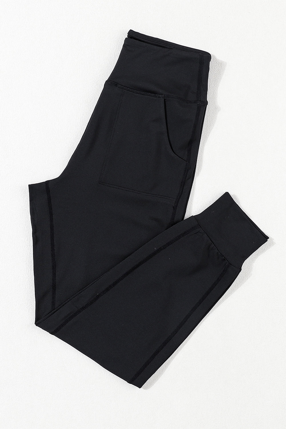 Black Exposed Seam High Waist Pocketed JoggersMaterial:100%Polyester



		These solid joggers are a versatile addition to your wardrobe, suitable for individuals of all body types.

	
		The exposed seam desi