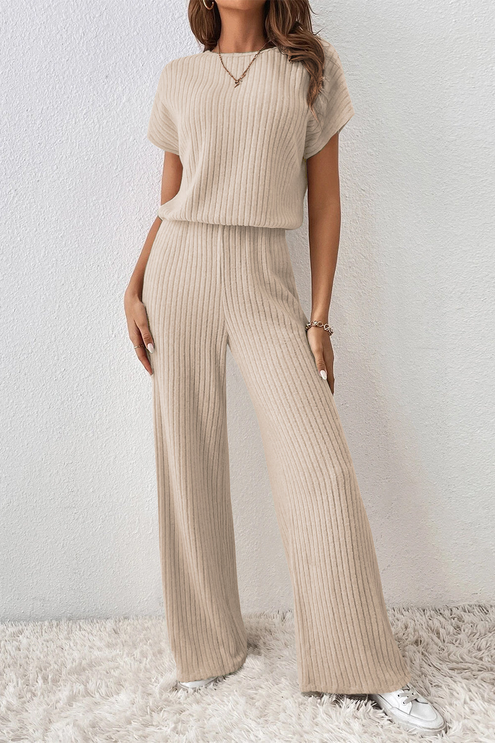 Grass Green Solid Color Ribbed Short Sleeve Wide Leg JumpsuitMaterial:85%Polyester+10%Viscose+5%Elastane



		The jumpsuit is a versatile and trendy one-piece outfit, featuring a solid color design that offers a sleek and mi