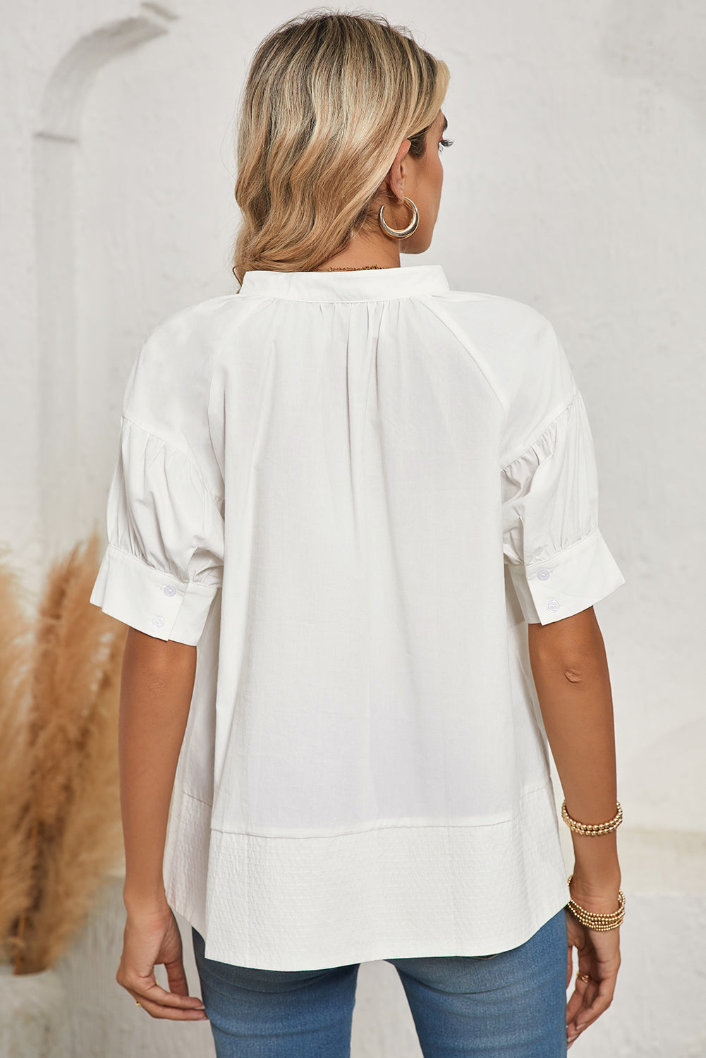 White Solid Color Ruched Bubble Sleeve V Neck ShirtMaterial:100%Cotton

• The ruched detailing on the sleeves adds a touch of texture and visual interest, making this top a standout choice for any occasion. 
• Craf