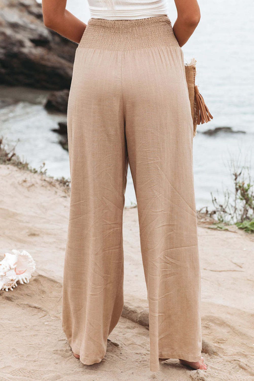 Black Smocked Wide Waistband High Waist Wide Leg PantsMaterial:65%COTTON+35%POLYESTER



		Flattering smocked waistband cinches at the
waist for a lovely silhouette
	
	
		High waist design elongates legs for a
st