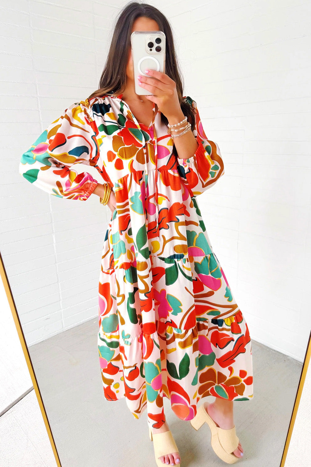 Orange Abstract Tie V Neck Tiered Maxi DressMaterial:100%Polyester

• Stand out in this maxi dress, perfect for boho-chic lovers seeking a vibrant statement piece.
• The abstract print adds a touch of artist