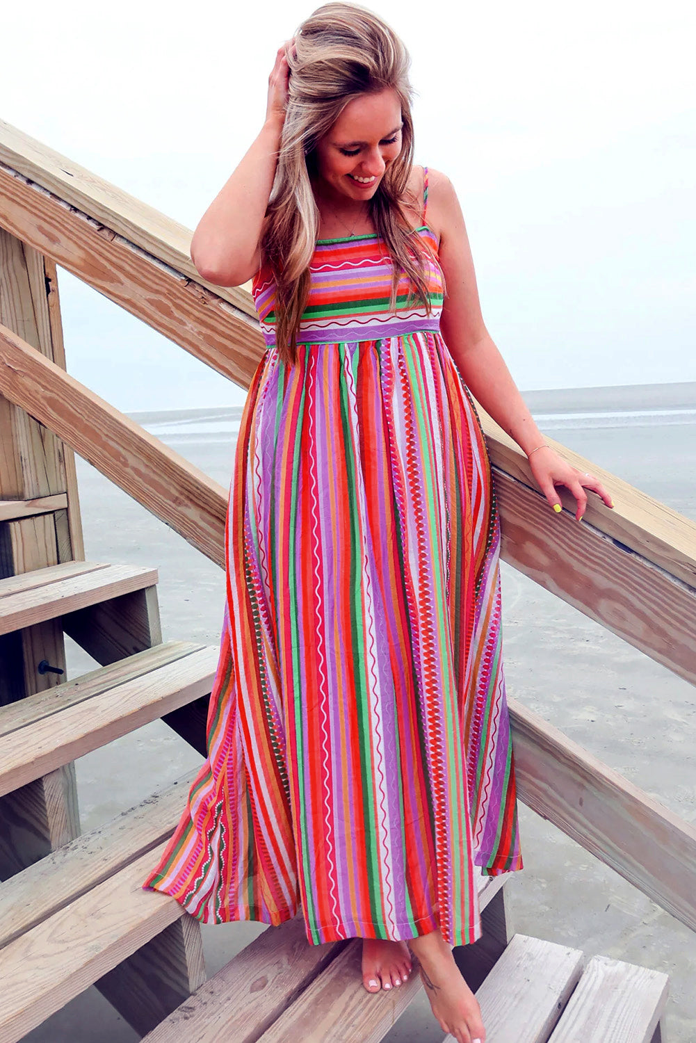 Multicolour Boho Striped Spaghetti Strap Smocked Back Maxi DressMaterial:100%Polyester

• Embrace a vibrant blend of colors in this maxi dress, perfect for daily wear with its relaxed, sleeveless design.
• The shirred back ensu