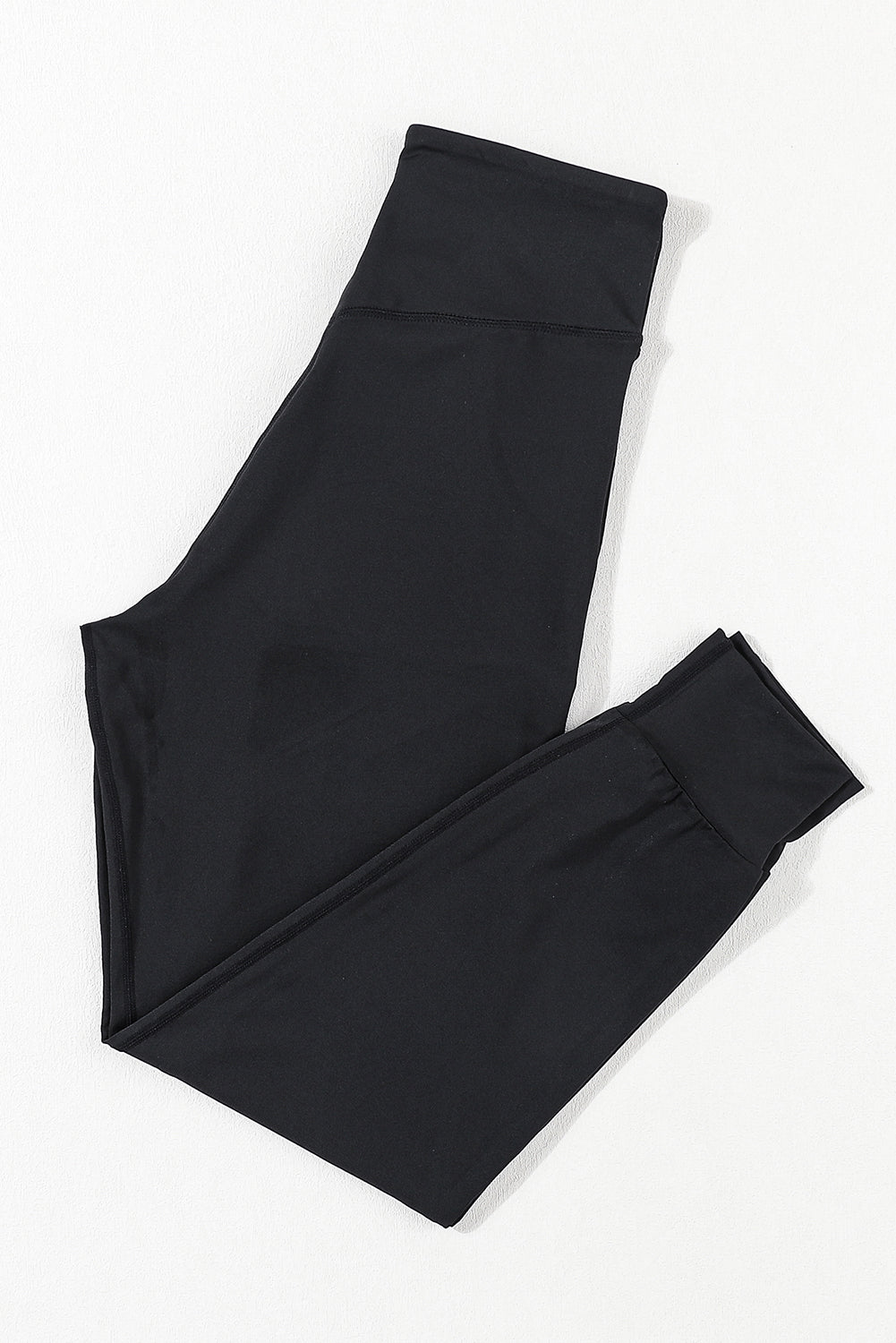 Black Exposed Seam High Waist Pocketed JoggersMaterial:100%Polyester



		These solid joggers are a versatile addition to your wardrobe, suitable for individuals of all body types.

	
		The exposed seam desi